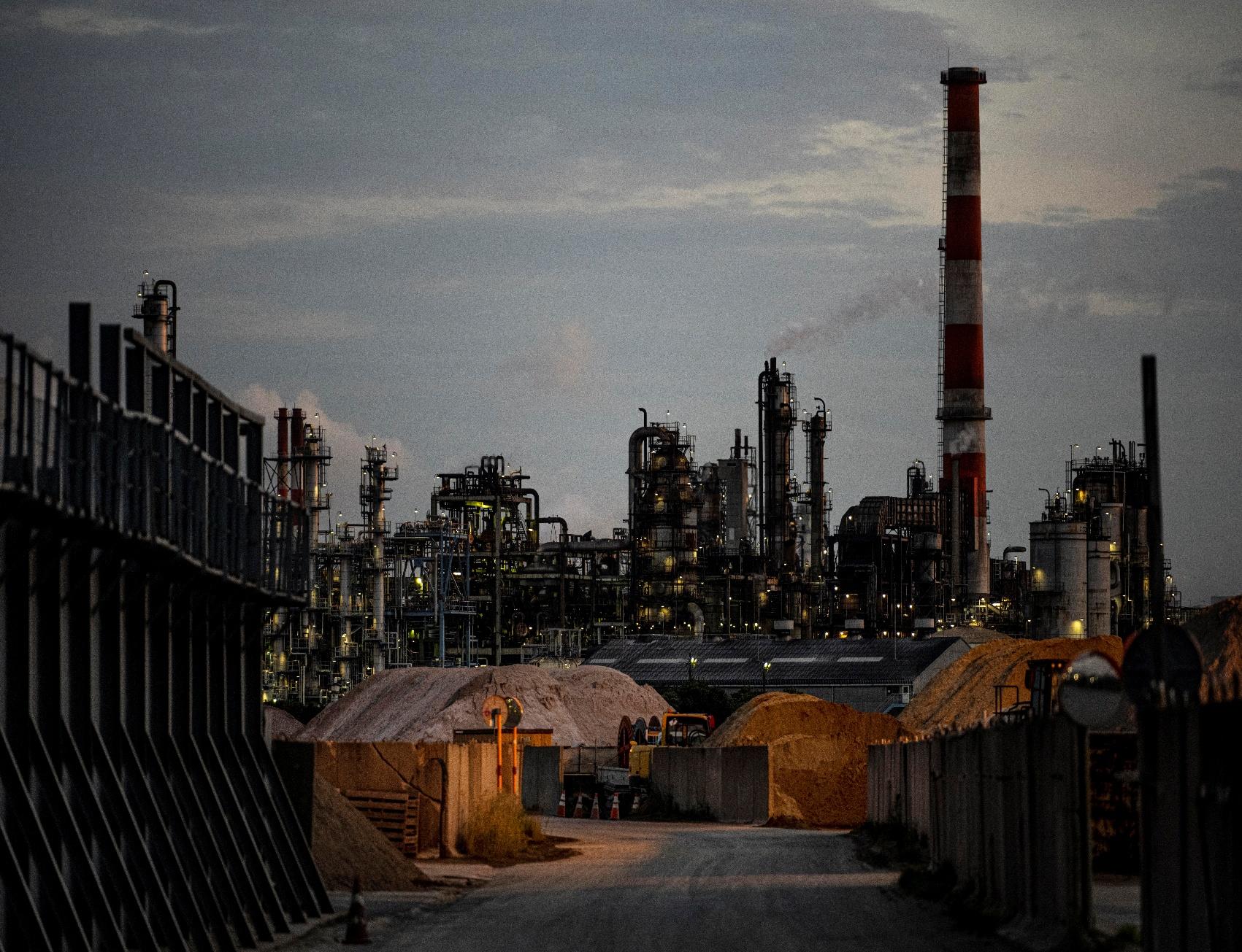 Industrial oil refinery complex at dusk